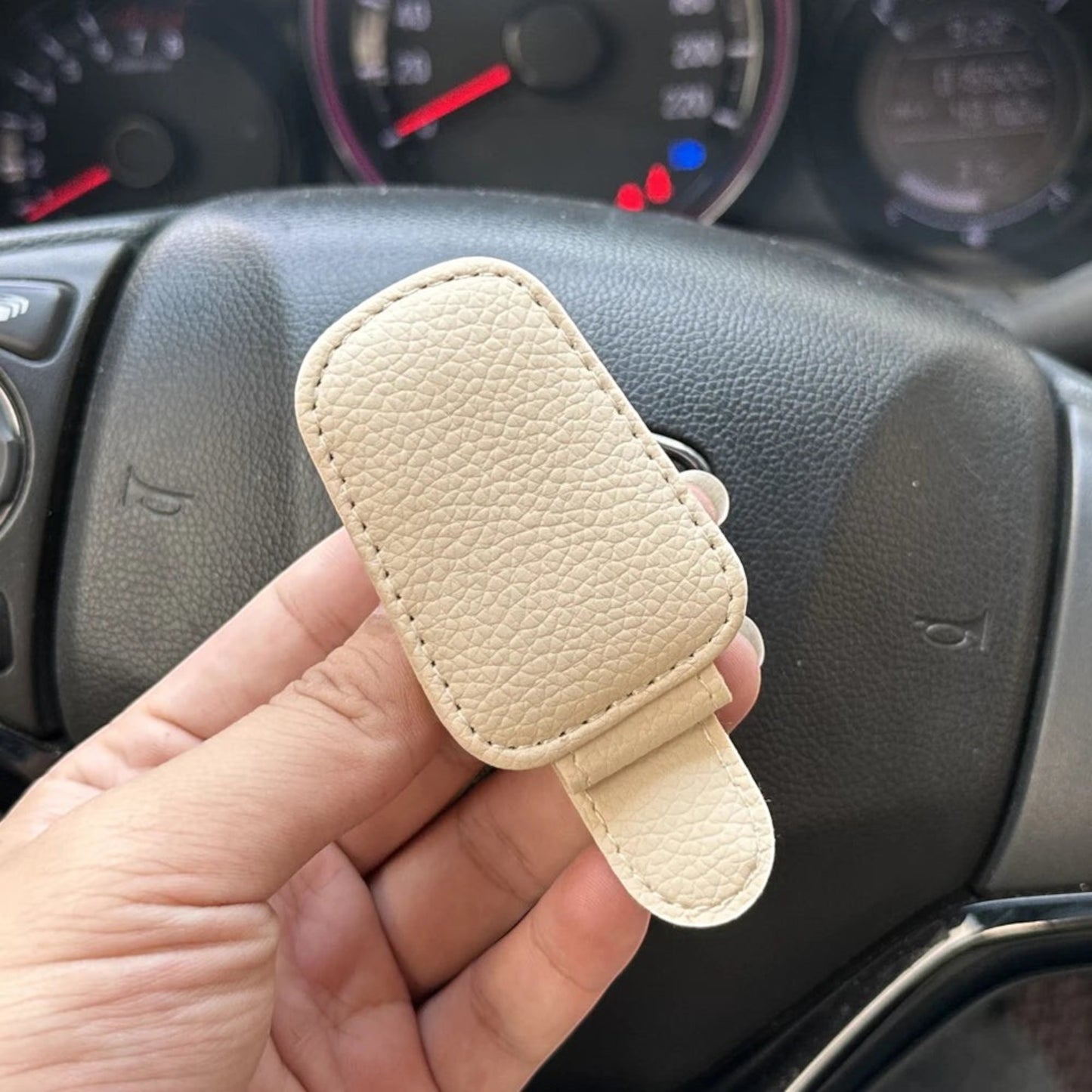 Elevate Automotive beige faux leather car visor clip for sunglasses with soft lining to prevent scratches.