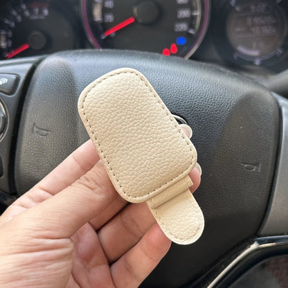 Elevate Automotive beige faux leather car visor clip for sunglasses with soft lining to prevent scratches.
