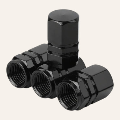 Elevate Automotive black machined aluminum tire valve caps, set of 4. Leak-proof and corrosion-resistant.