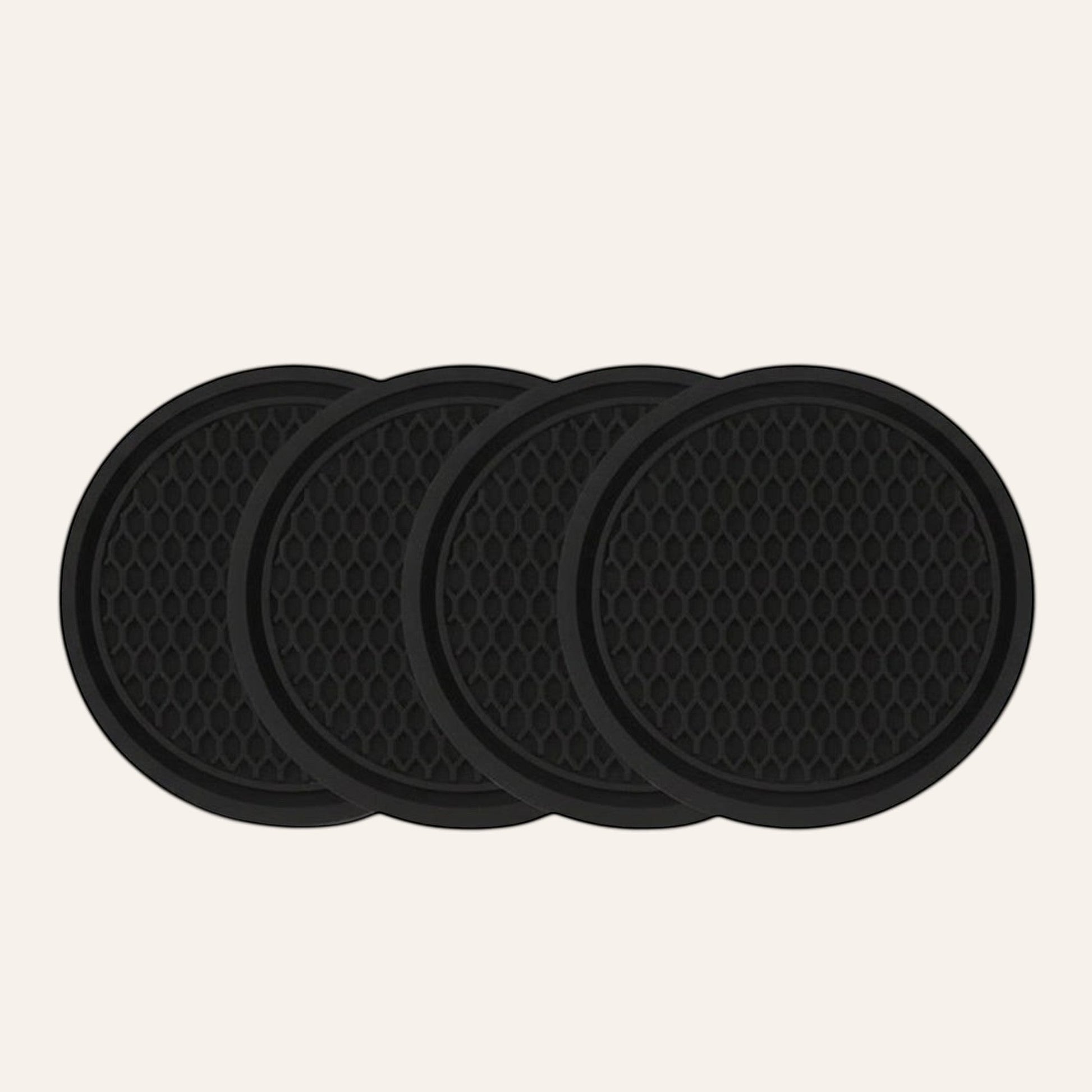 Elevate Automotive set of 4 black silicone anti-slip cup holder mats with honeycomb texture.