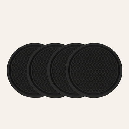Elevate Automotive set of 4 black silicone anti-slip cup holder mats with honeycomb texture.