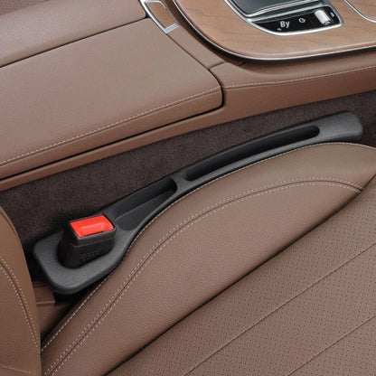 Elevate Automotive black car seat gap organizer with built-in pockets and red seatbelt buckle.