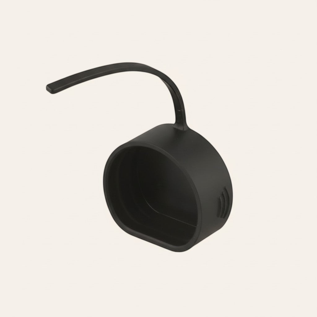 Elevate Automotive black rubber EV charging port dust cap, protects against debris and moisture.