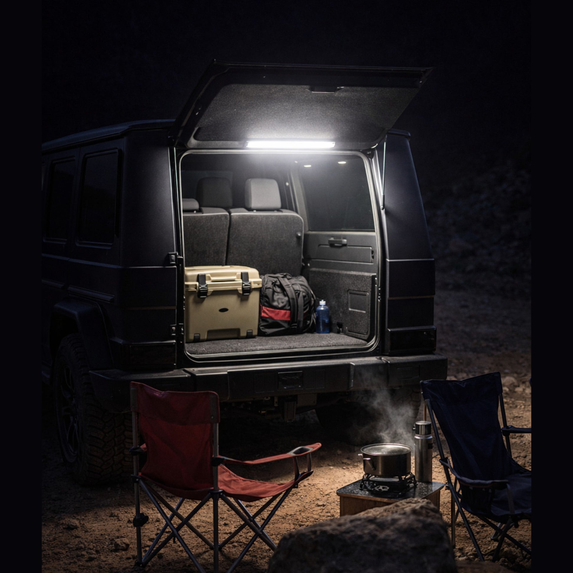 Elevate Automotive Off-Road Essentials kit with tire deflator, gauge, LED light, and valve caps in a vehicle trunk.