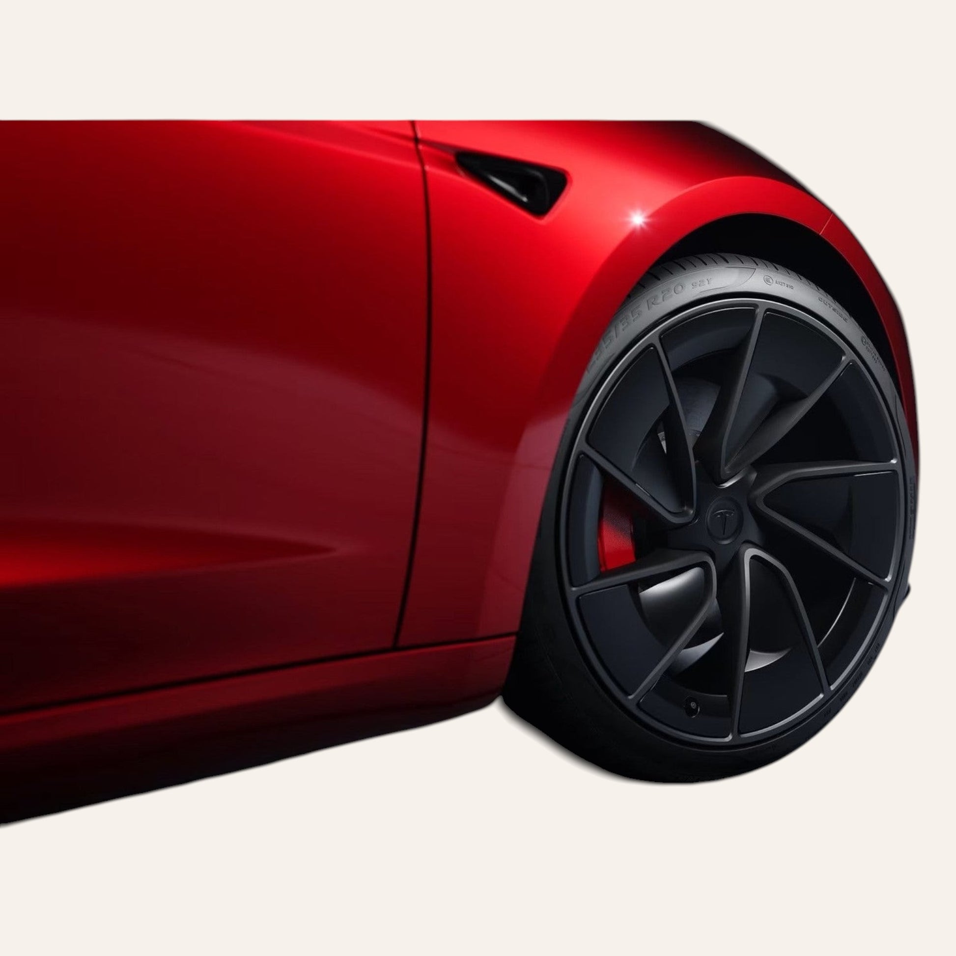 Elevate Automotive red Tesla Model 3/Y with black performance wheels and red brake calipers.