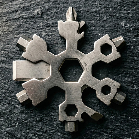 Elevate Automotive stainless steel snowflake multi-tool with screwdrivers, bottle opener, and hex wrenches.