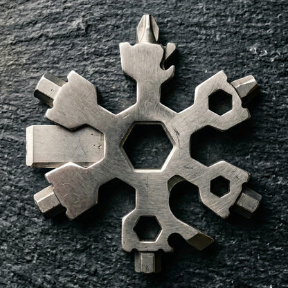 Elevate Automotive stainless steel snowflake multi-tool with screwdrivers, bottle opener, and hex wrenches.