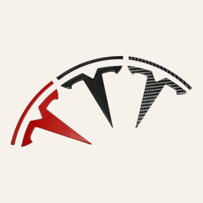 Elevate Automotive Tesla Model 3/Y ABS emblem badges in matte black, carbon fiber, and red finishes.