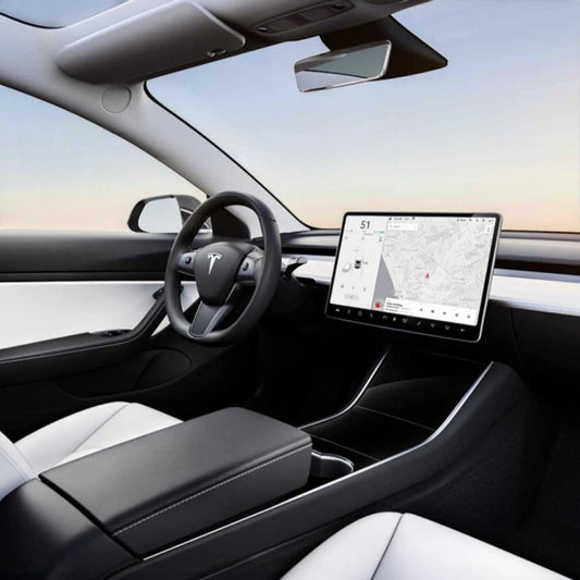 Elevate Automotive Interior Essentials Kit for Tesla Model 3/Y. Black and white interior with organizer, mats, mount, covers, and screen protector.