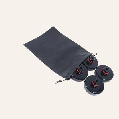 Elevate Automotive black rubber Tesla jack lift pads with red accents, set of 4 in a black storage bag.